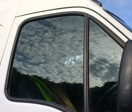 clouds in van window