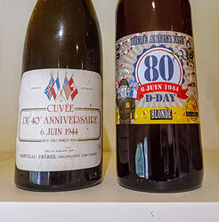 Two D-Day commemorative bottles, 40 years apart.