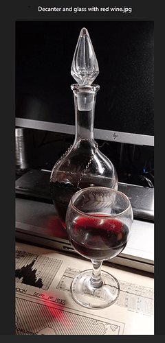 Decanter and glass with red wine